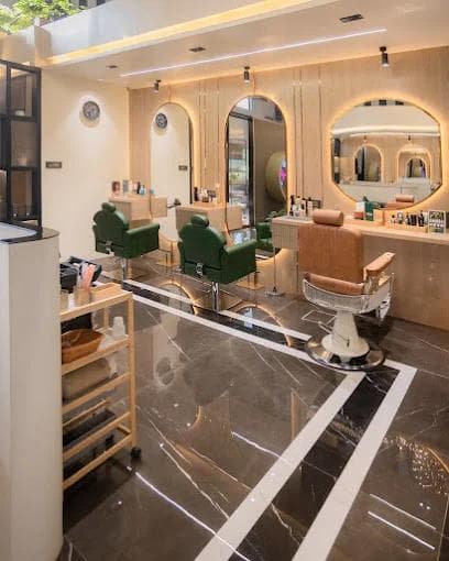 Warm salon interior with styling stations and mirrors